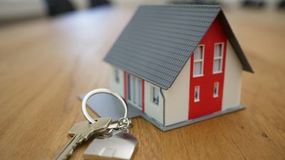 A model house beside a set of keys